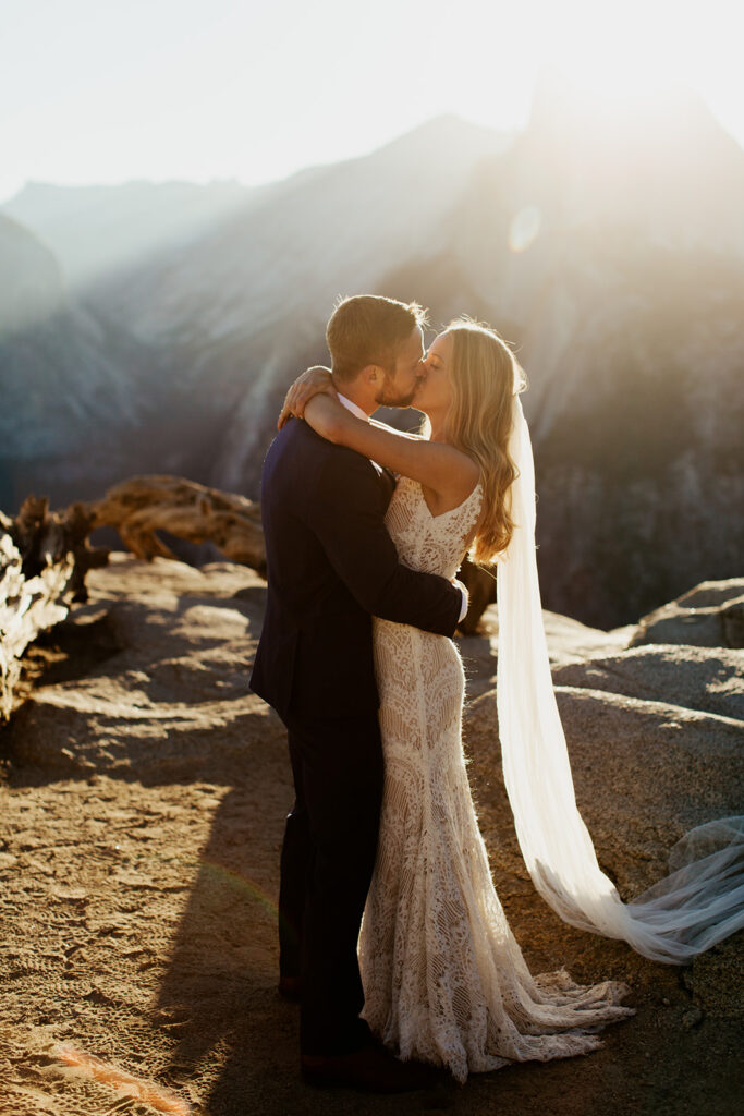 couple kisses at Glacier Point elopement