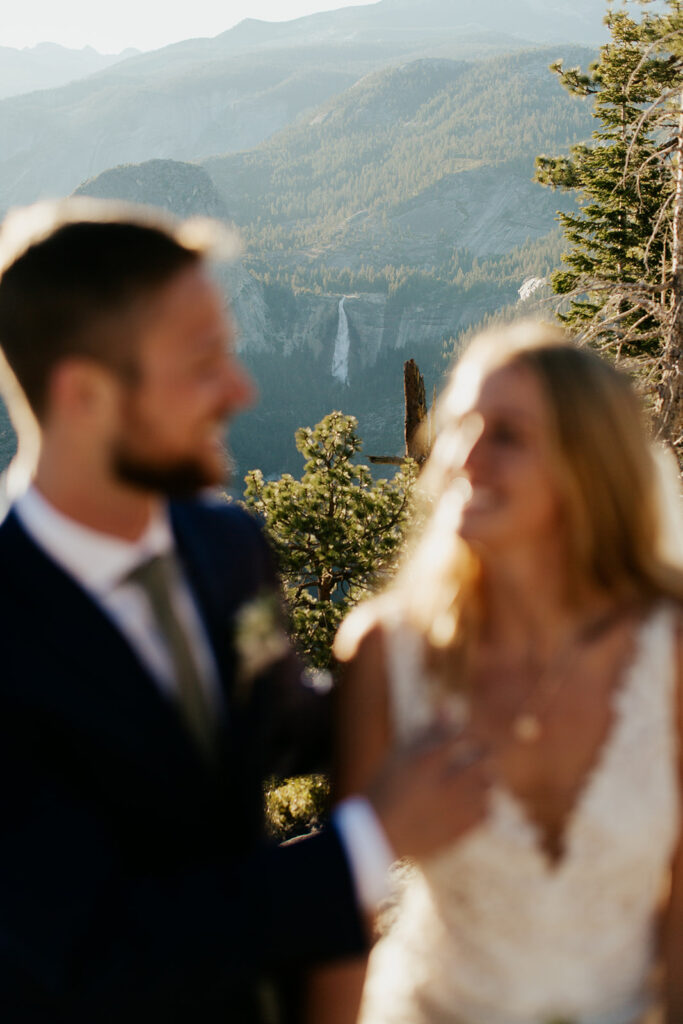 couple sits in front of falls at elopement