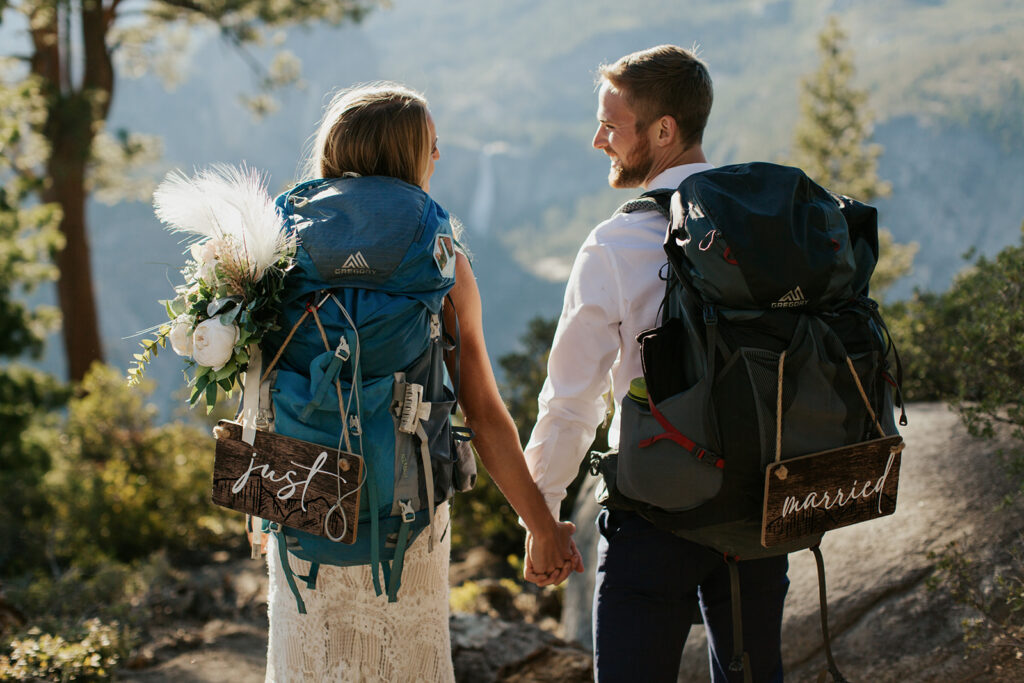 couple holds hands at Yosemite backpacking elopement