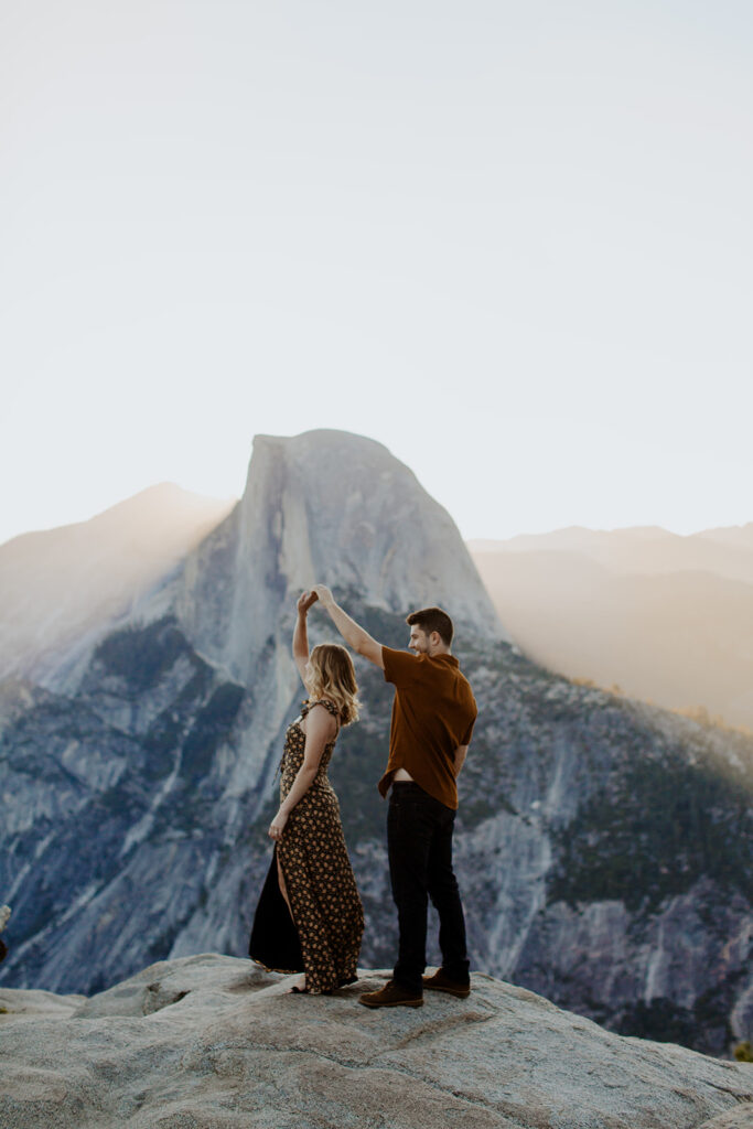 couple twirls at Glacier Point Yosemite overlook