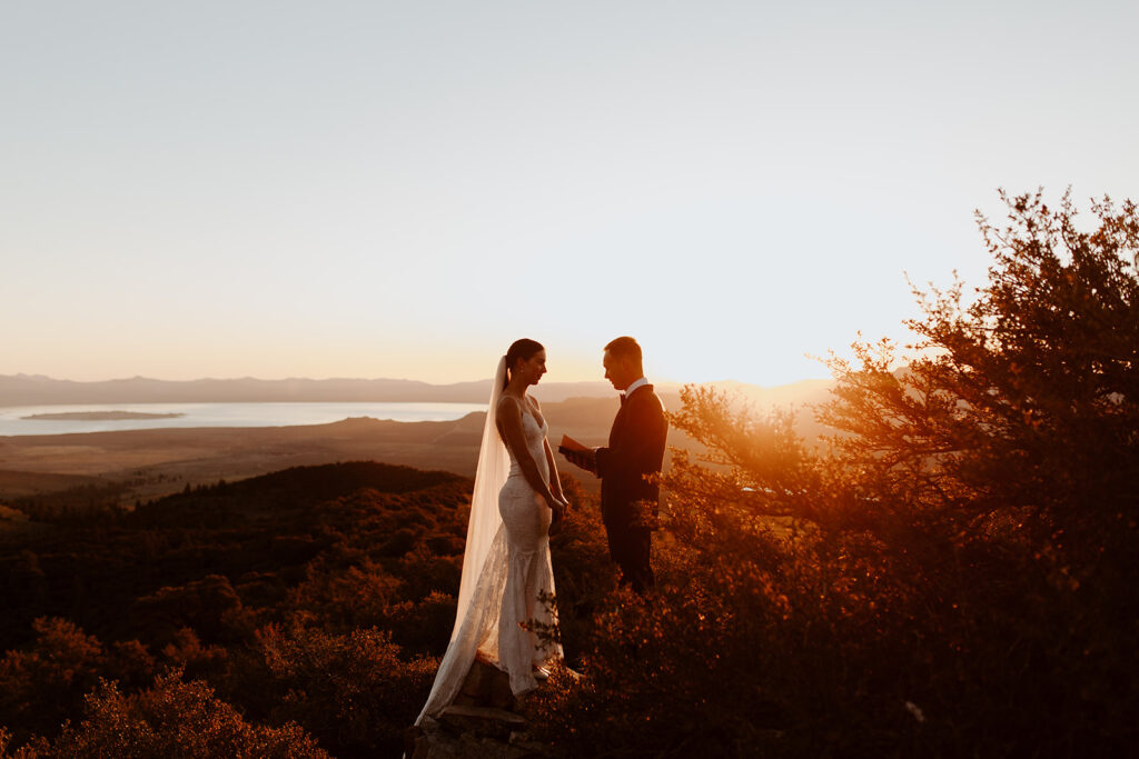 couple exchanges vows at sunrise outdoor elopement