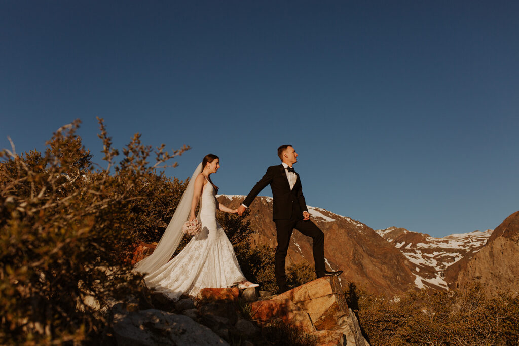 couple walks through Sierra Nevada mountains at outdoor elopement