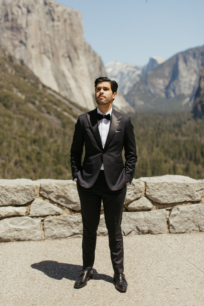 groom stands in Tunnel View during wedding first look