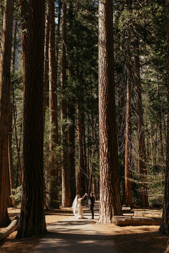 couple walks through woods