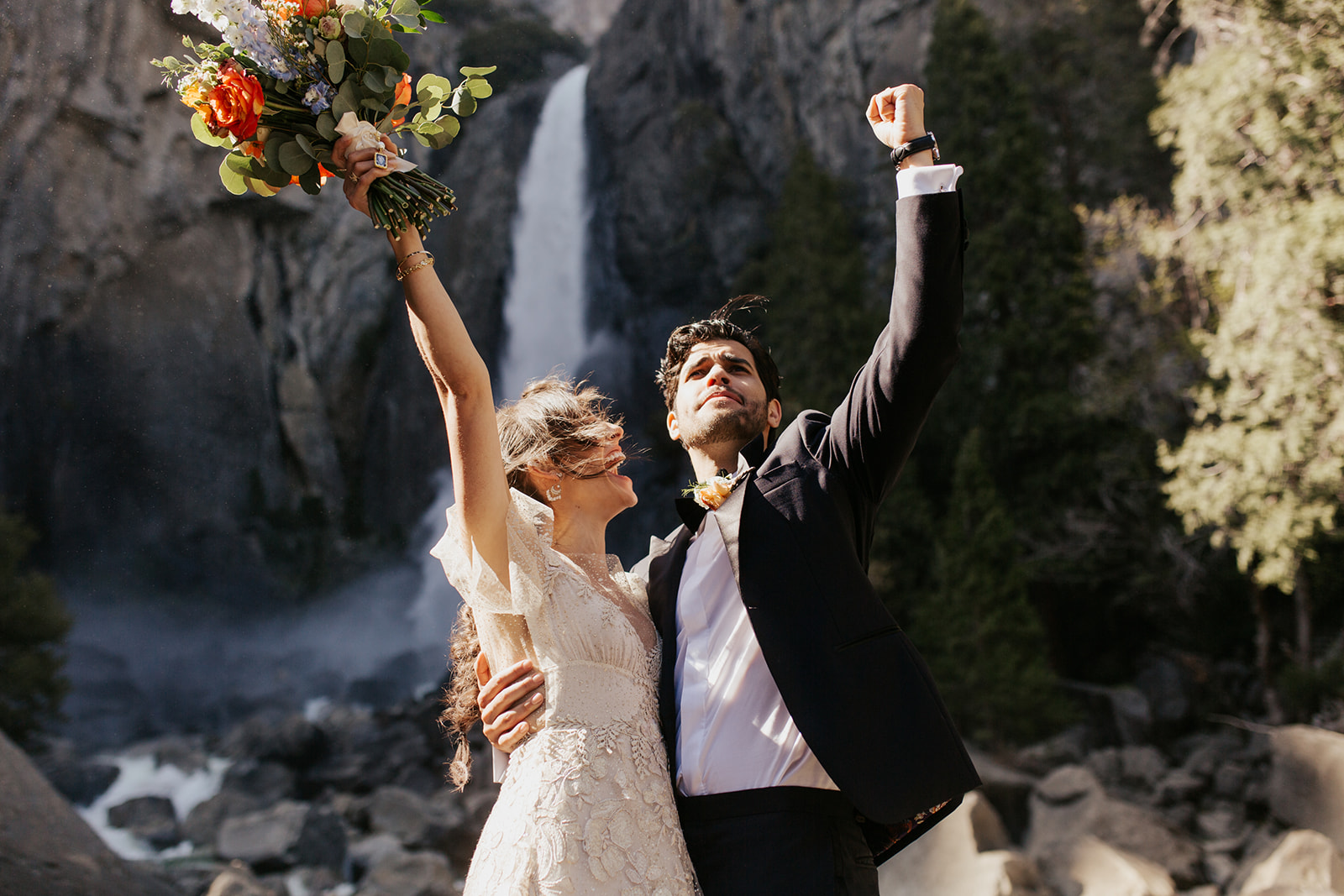 couple cheers at Yosemite Falls elopement