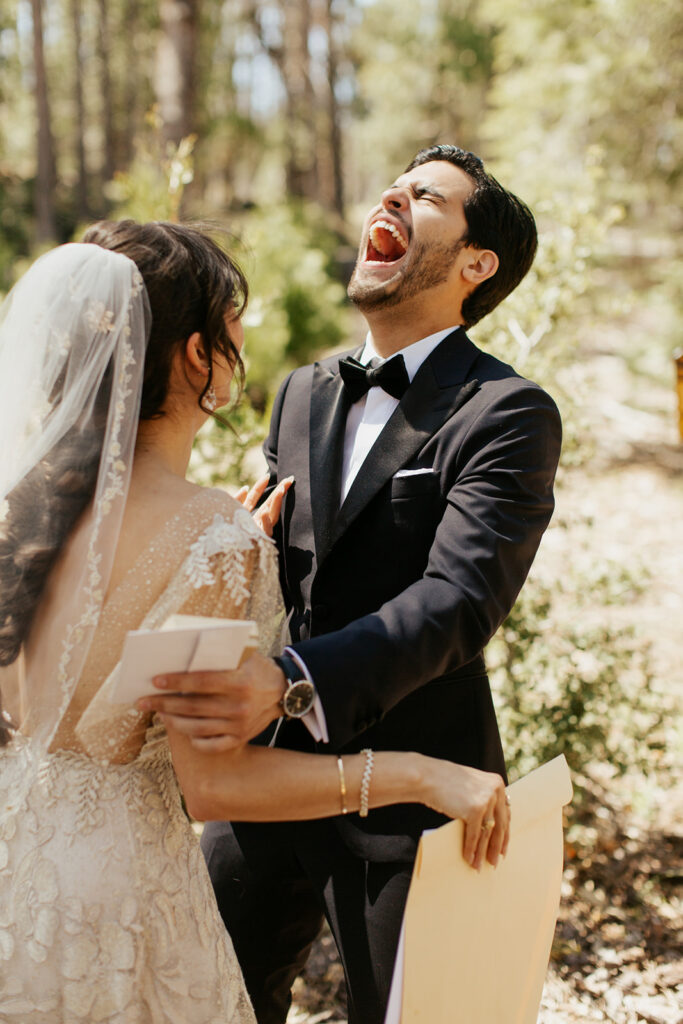 couple laughs during wedding first look