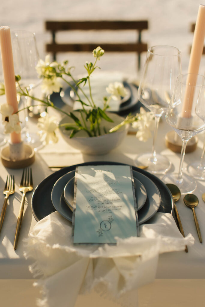 candles and greenery on reception table at salt flats