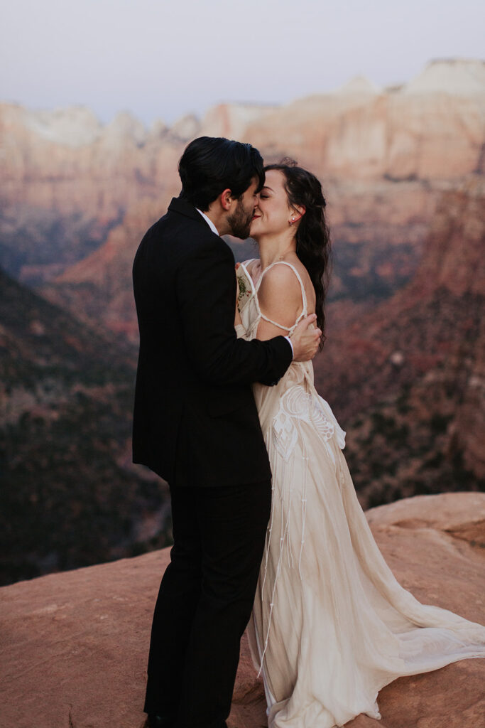 couple kisses at Canyon Overlook elopement