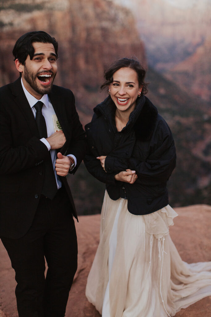 couple elopes on overlook at Zion National Park wedding