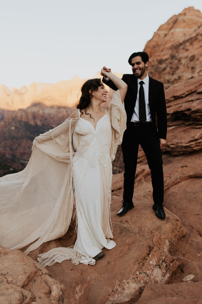 couple twirls at outdoor mountain top elopement